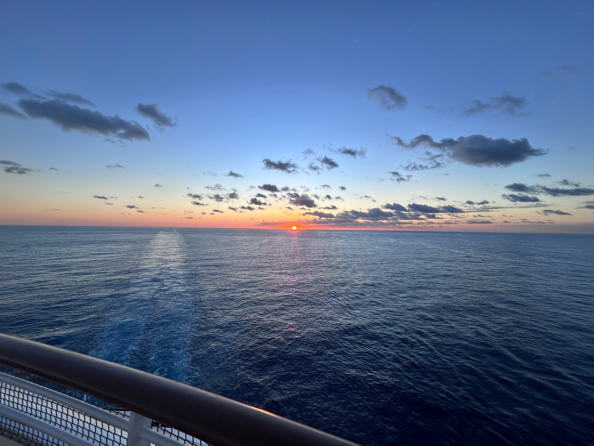 Sunset over the ocean viewed from a cruise ship